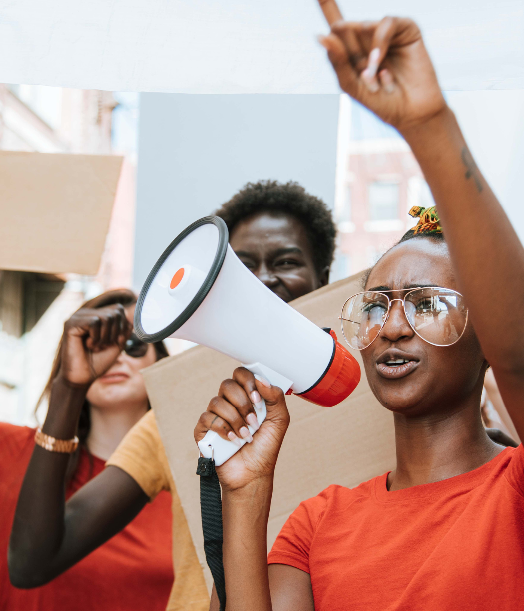Bolder Advocacy - someone with a megaphone peacefully protests